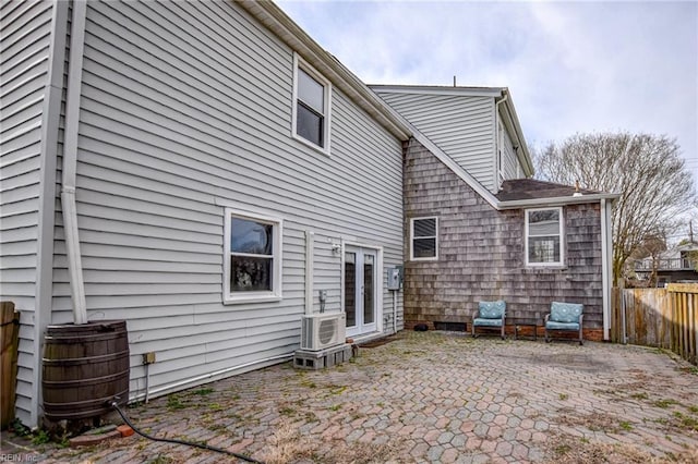 back of property with a patio area and fence