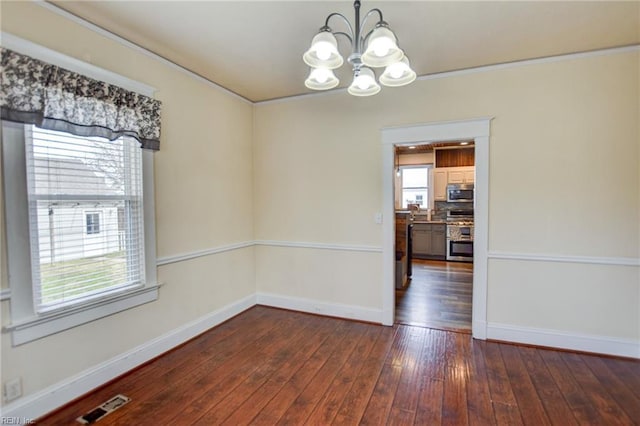 unfurnished dining area featuring visible vents, baseboards, dark wood-type flooring, and a chandelier