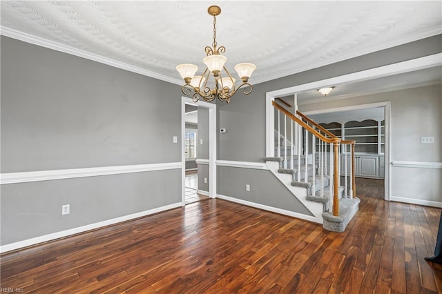 interior space with hardwood / wood-style floors, stairway, baseboards, and ornamental molding