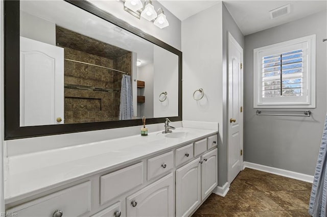 full bathroom featuring vanity, a shower with curtain, baseboards, and visible vents