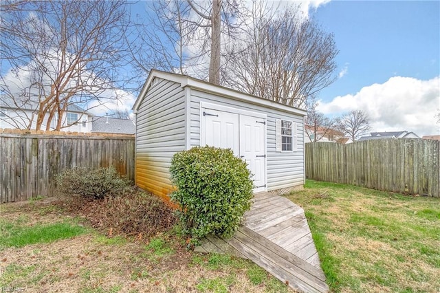 view of shed featuring a fenced backyard