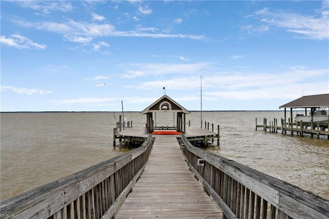 view of dock with a water view and boat lift