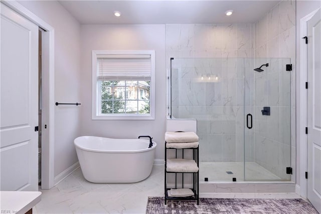 bathroom featuring a shower stall, baseboards, recessed lighting, a soaking tub, and marble finish floor