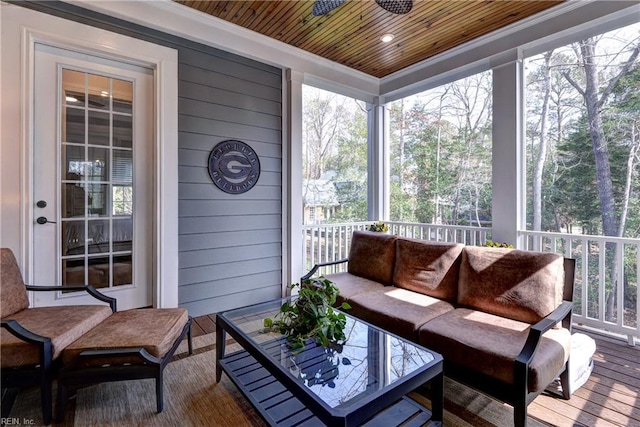 sunroom featuring wood ceiling