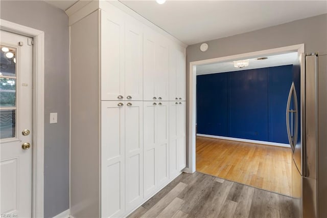 hallway with light wood finished floors