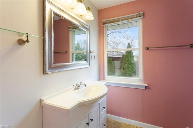 bathroom with baseboards and vanity