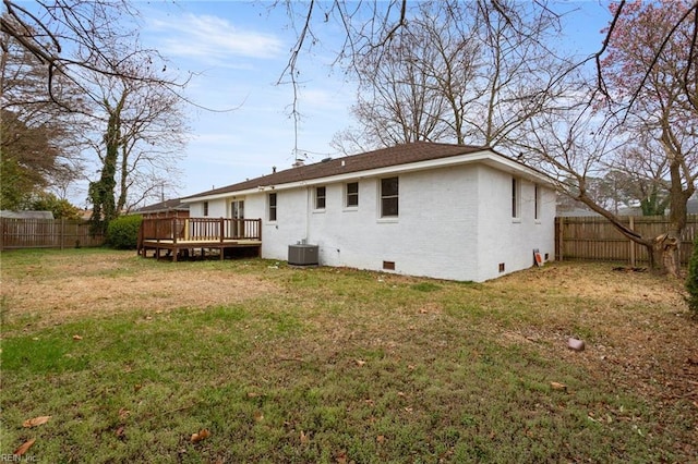 rear view of property with crawl space, a fenced backyard, a wooden deck, and central AC