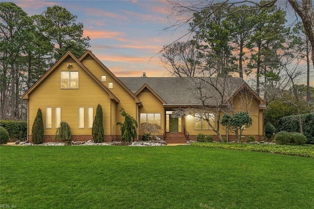 view of front of house with a yard