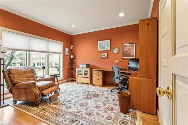 home office with recessed lighting, built in study area, light wood-type flooring, and ornamental molding