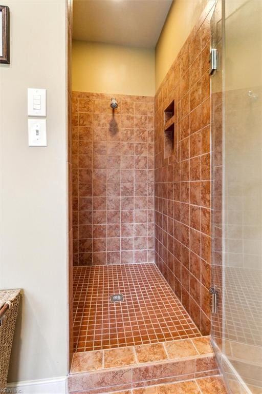 full bath featuring a shower stall