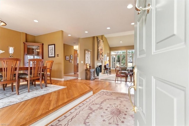 entrance foyer with recessed lighting, baseboards, and wood finished floors