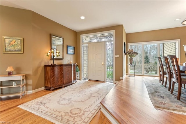 entrance foyer featuring recessed lighting, baseboards, and wood finished floors