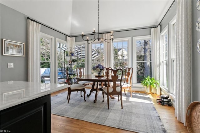 dining room featuring a notable chandelier and light wood finished floors