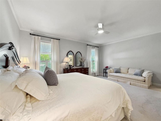 carpeted bedroom featuring ceiling fan, baseboards, ornamental molding, and access to exterior