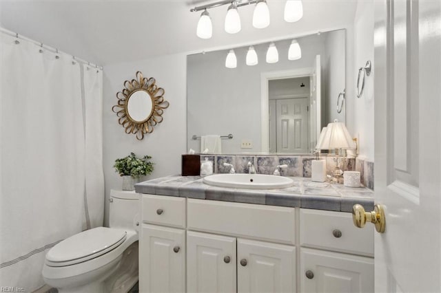 full bathroom featuring vanity and toilet