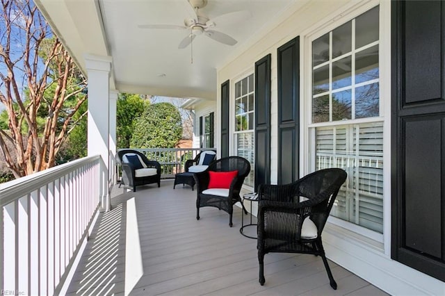 deck featuring a porch and a ceiling fan