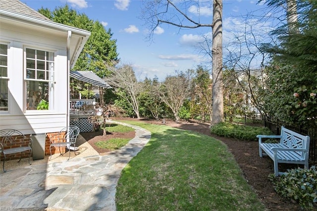 view of yard featuring a patio area and fence