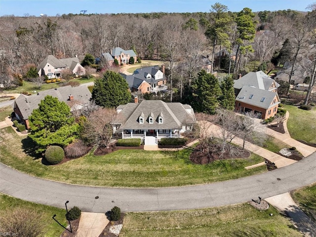 bird's eye view with a residential view and a view of trees