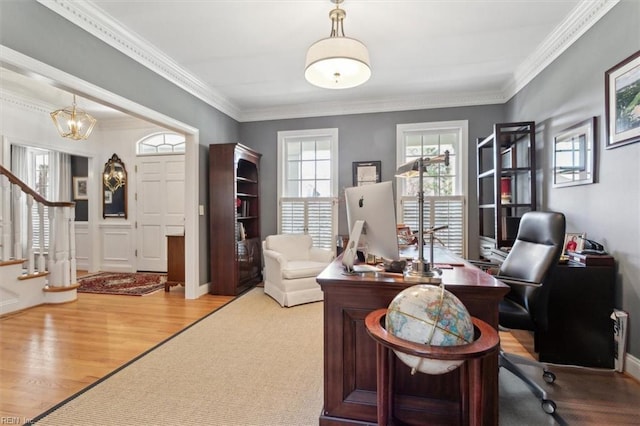 office featuring an inviting chandelier, wood finished floors, and crown molding