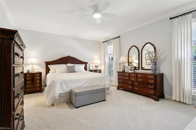 bedroom featuring a ceiling fan, light colored carpet, and crown molding