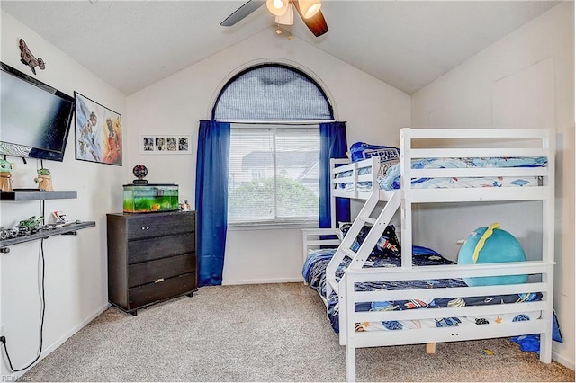 carpeted bedroom featuring lofted ceiling and ceiling fan