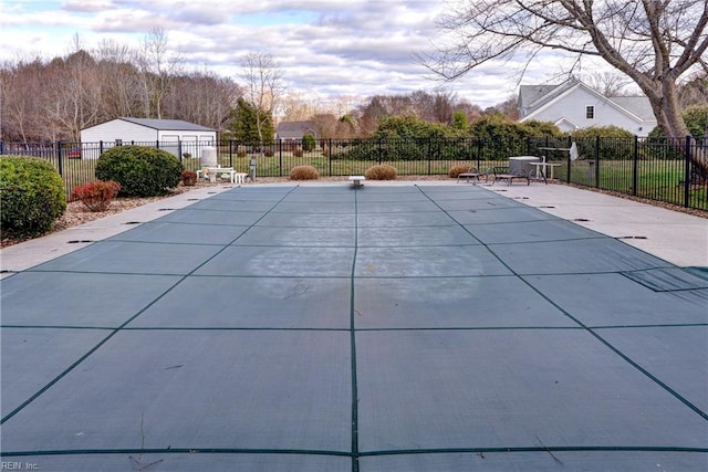 view of swimming pool featuring a fenced in pool, a patio, and fence