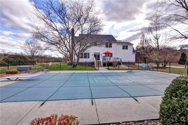 view of swimming pool featuring a fenced in pool, a patio, and fence