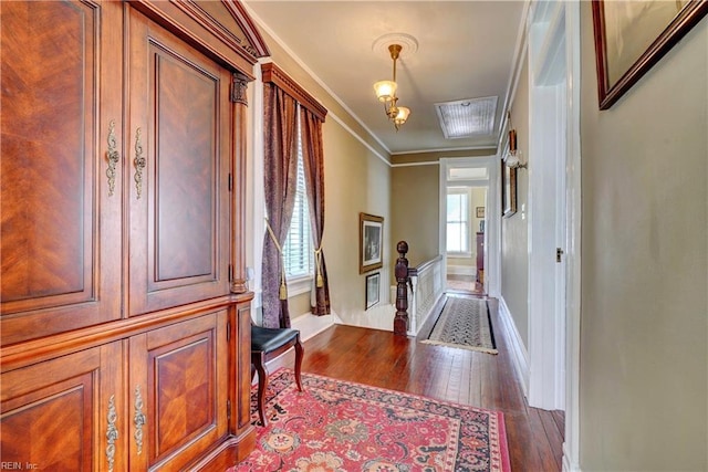 entrance foyer featuring crown molding, baseboards, and wood-type flooring