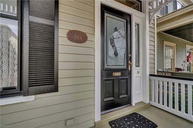 entrance to property with covered porch