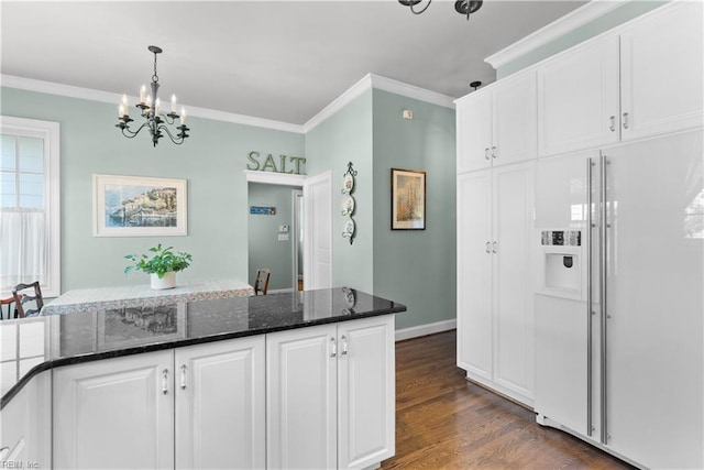 kitchen with dark wood finished floors, white cabinetry, high end white fridge, and crown molding