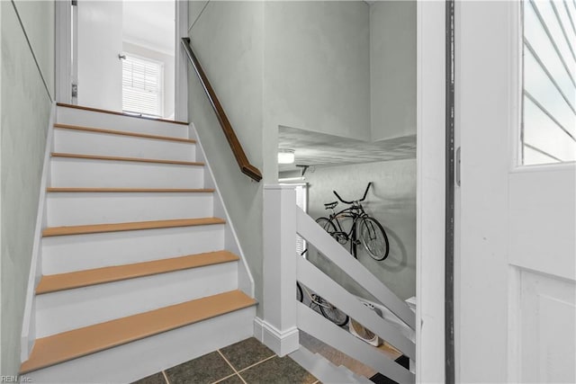 stairs with tile patterned floors