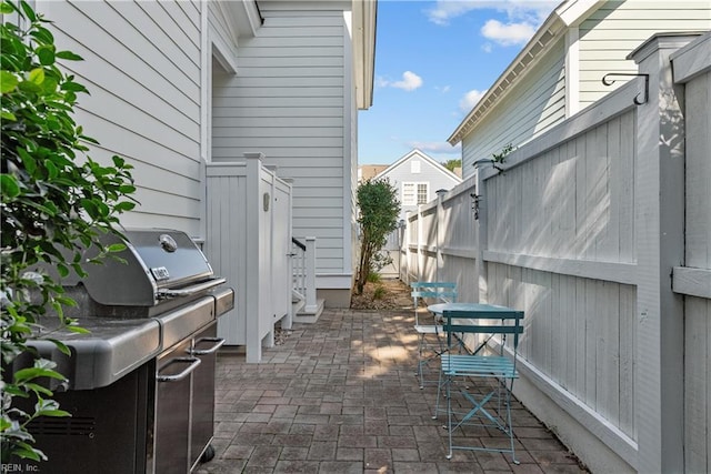 view of patio / terrace featuring fence