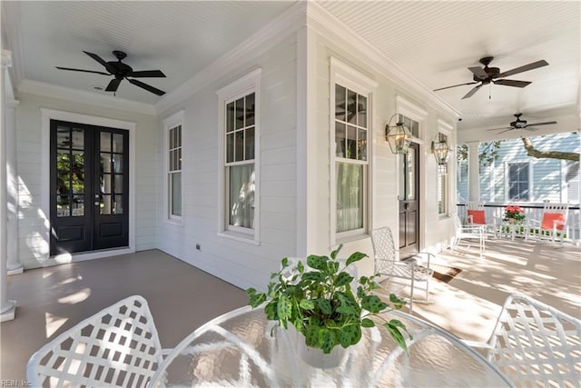 view of patio / terrace featuring ceiling fan, a porch, and french doors