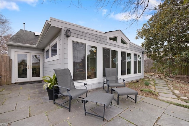 view of patio / terrace with french doors and fence