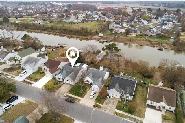 birds eye view of property featuring a residential view and a water view