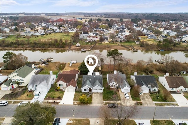 aerial view featuring a residential view and a water view