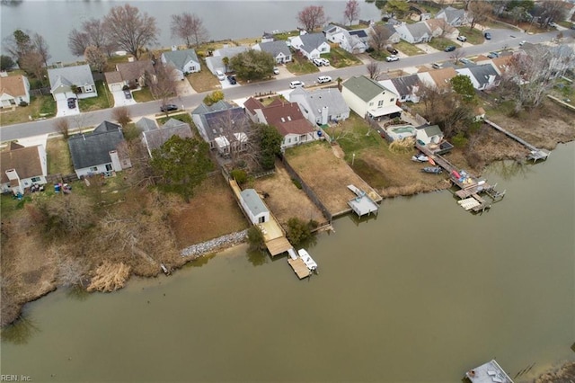 birds eye view of property with a residential view and a water view