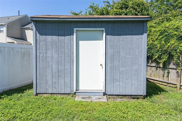 view of shed with fence