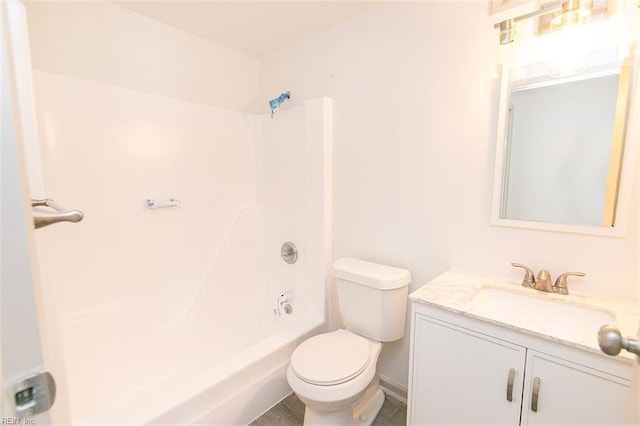 bathroom with shower / washtub combination, toilet, and vanity