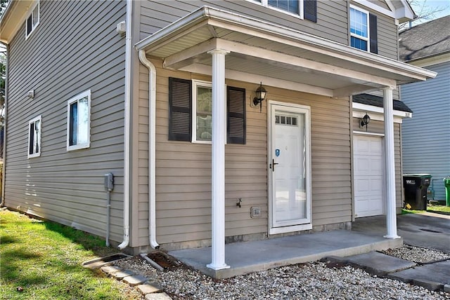 doorway to property featuring a garage