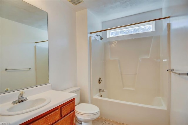 bathroom with vanity, visible vents, tile patterned flooring, shower / bath combination, and toilet