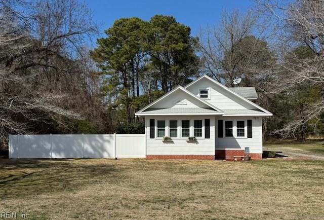 exterior space featuring a yard and fence