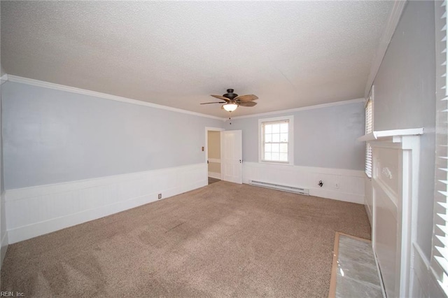 unfurnished living room featuring a ceiling fan, a textured ceiling, carpet, wainscoting, and baseboard heating