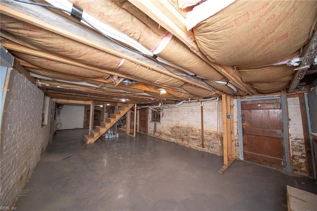 unfinished basement with stairway