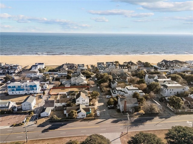 bird's eye view with a beach view, a residential view, and a water view