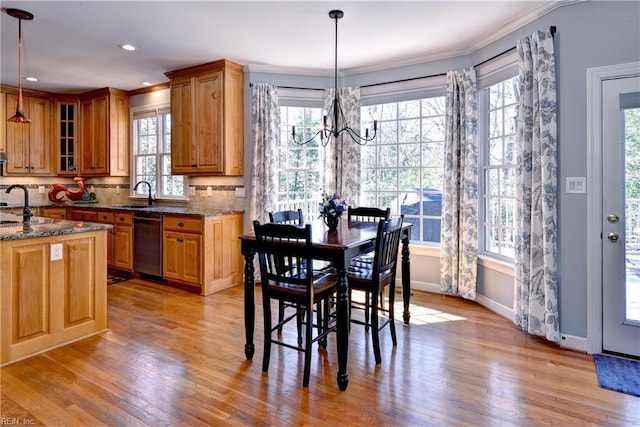 dining room featuring recessed lighting, baseboards, a chandelier, and light wood finished floors