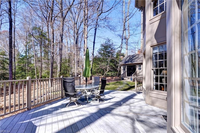 deck with outdoor dining area