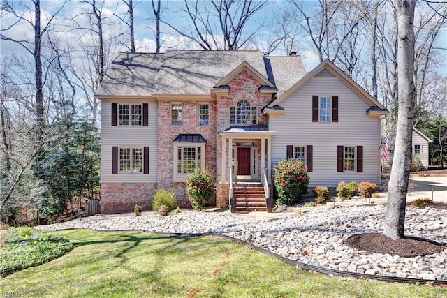 view of front of property featuring a chimney and a front lawn