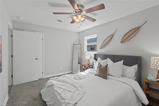 bedroom with visible vents, carpet flooring, baseboards, and a ceiling fan