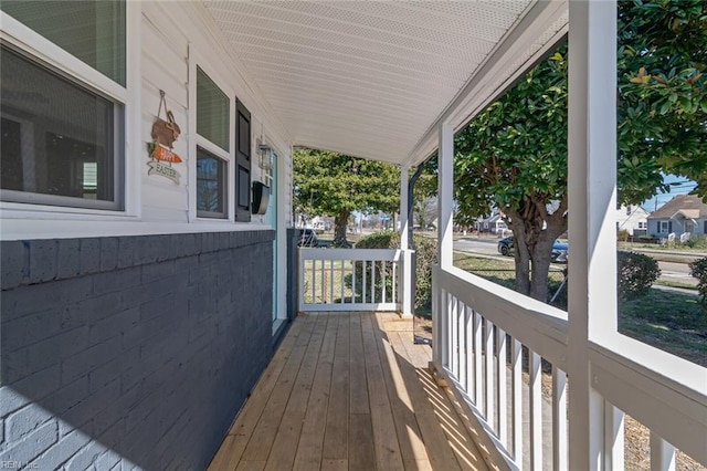 wooden terrace featuring covered porch